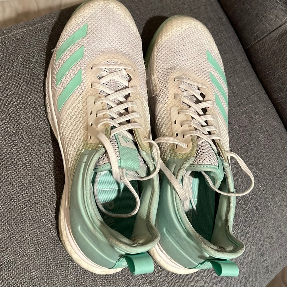 Adidas volleyball shoes.  Women’s 9.  Some wear but worn with different insoles